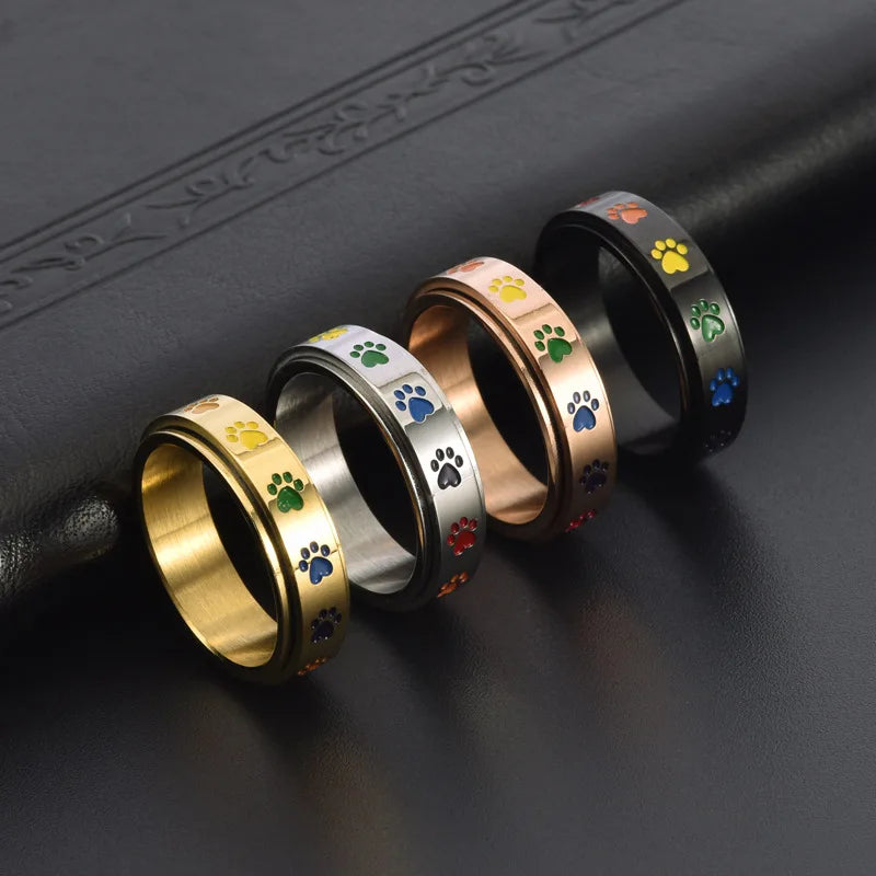 Spinning Stress Reducing Paw Ring ÃƒÂ¢Ã¢â€šÂ¬Ã¢â‚¬Å“ Stainless Steel with Rainbow Paws