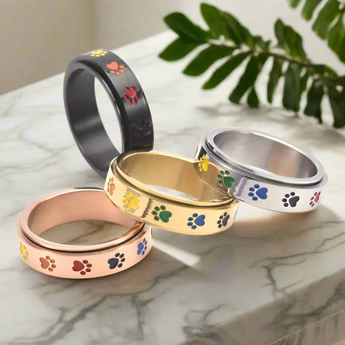 Spinning Stress Reducing Paw Ring ÃƒÂ¢Ã¢â€šÂ¬Ã¢â‚¬Å“ Stainless Steel with Rainbow Paws