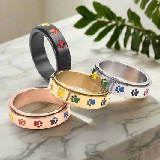 Spinning Stress Reducing Paw Ring ÃƒÂ¢Ã¢â€šÂ¬Ã¢â‚¬Å“ Stainless Steel with Rainbow Paws